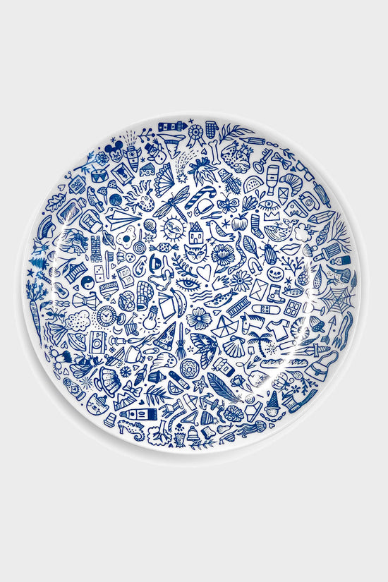 An illustrated porcelain plate, made in Germany and designed by Tattoo-Artist Suflanda. This screen printed plate adds charm and cheer to your morning routine - and makes a lovely go to gift for any special occasion. We love the sheer number of things that have ended up on our little plate with doodle print, there is a lot to discover!