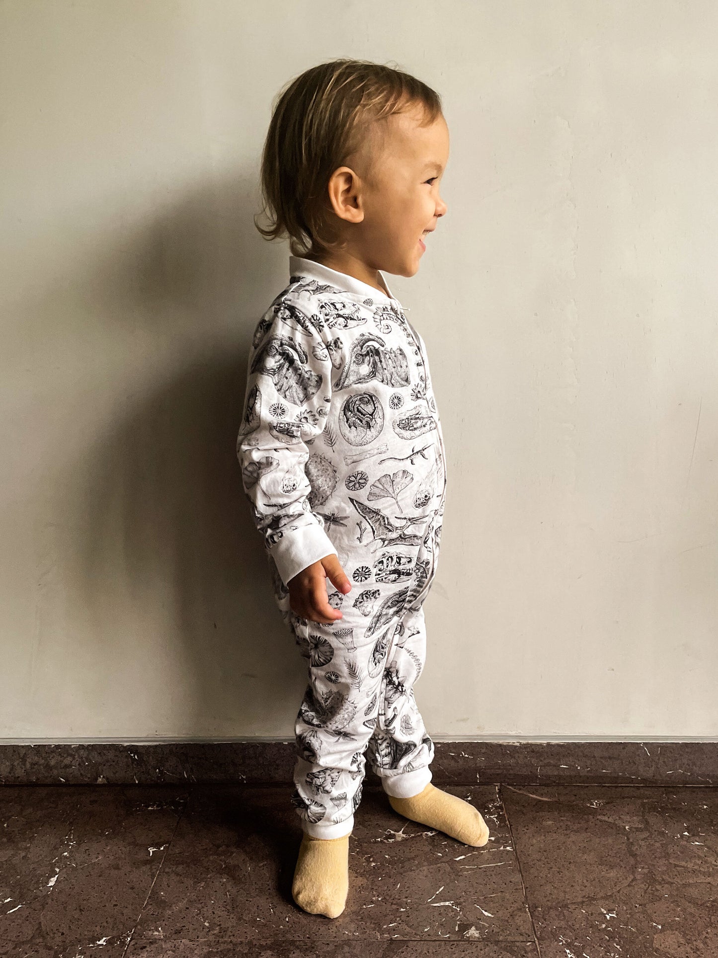 Babies or Explorers to be will sleep soundly in this lightweight soft cotton pyjama. Are you ready for prehistoric cuddles with your little one? This soft and comfy Onesie features prehistoric illustrations by Tattoo-Artist Suflanda!