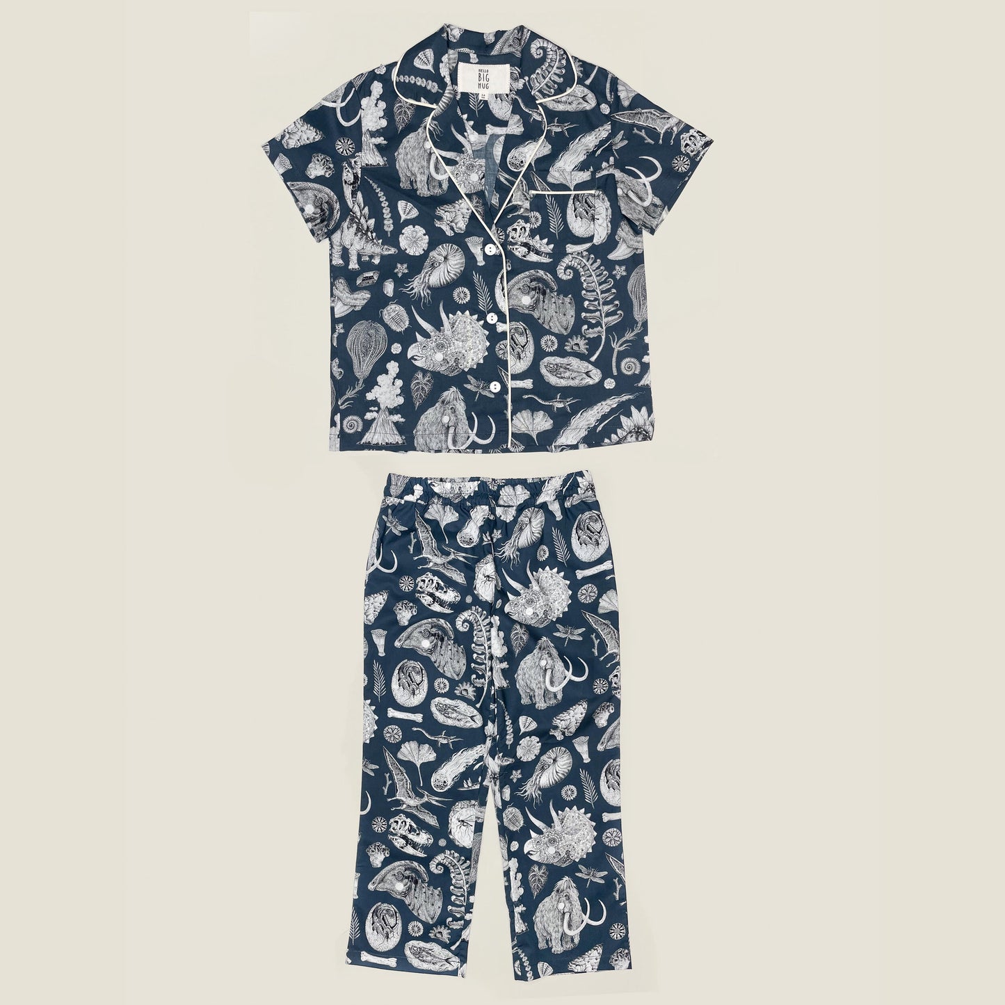Inspired by the beautiful prehistoric illustration by Tattoo-Artist Suflanda this Children Pyjama Set guarantes sweet dreams. The tiny details on sleeve add a tailored hint to the classic shape. The long pants feature an elasticated waist and are easy to wear on extraordinary adventures and comfy to roll in bed